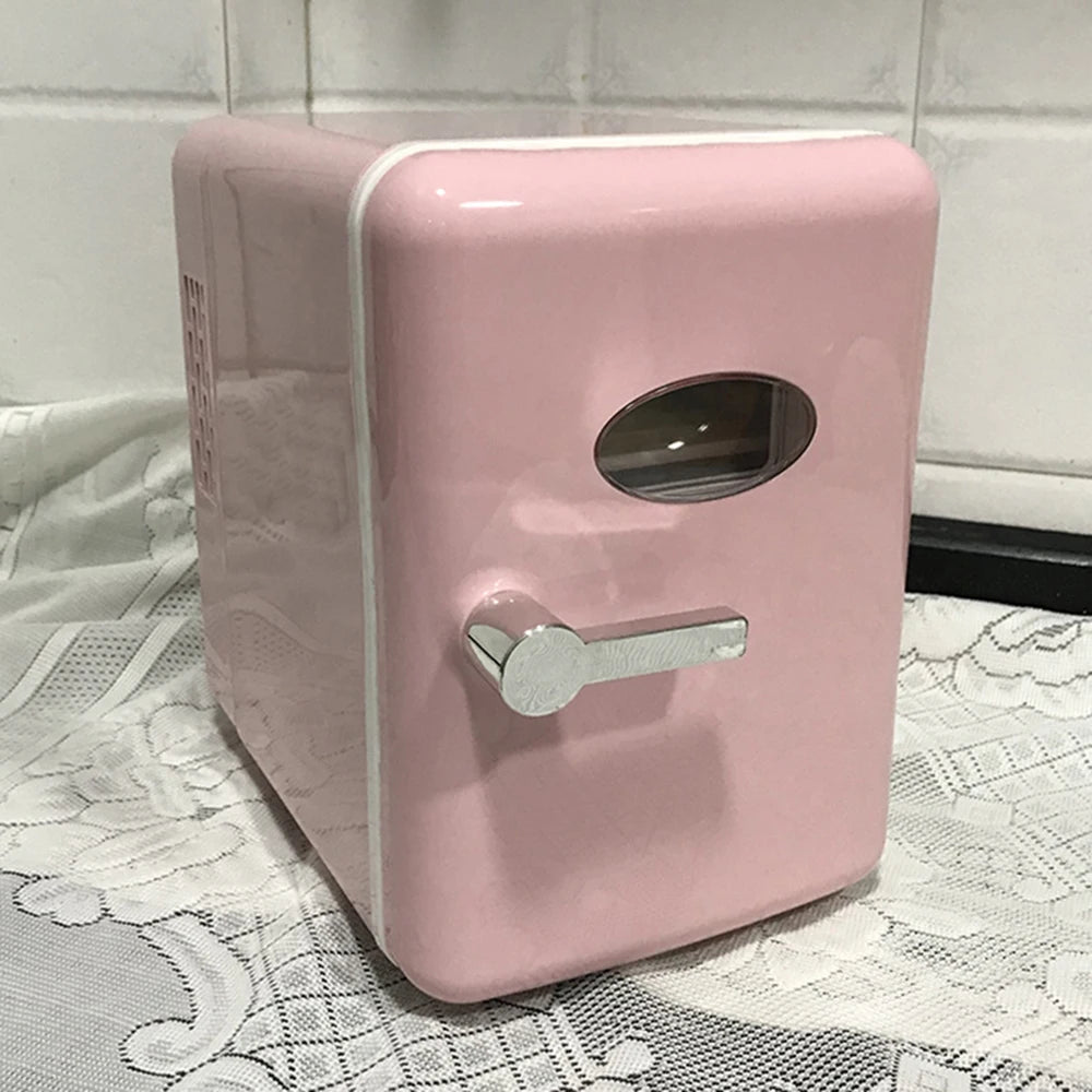 Pink mini refrigerator on a lace tablecloth with a tiled wall background