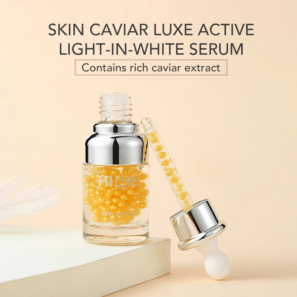 Skin Caviar Luxe Active Light-In-White Serum with dropper on a beige background